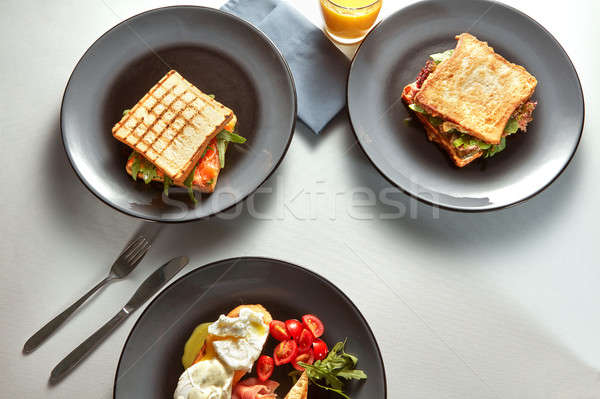 Traditional breakfast of sandwiches and juice Stock photo © artjazz