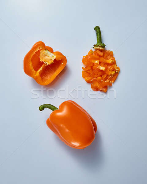 Stock photo: whole and sliced sweet peppers isolated on gray background