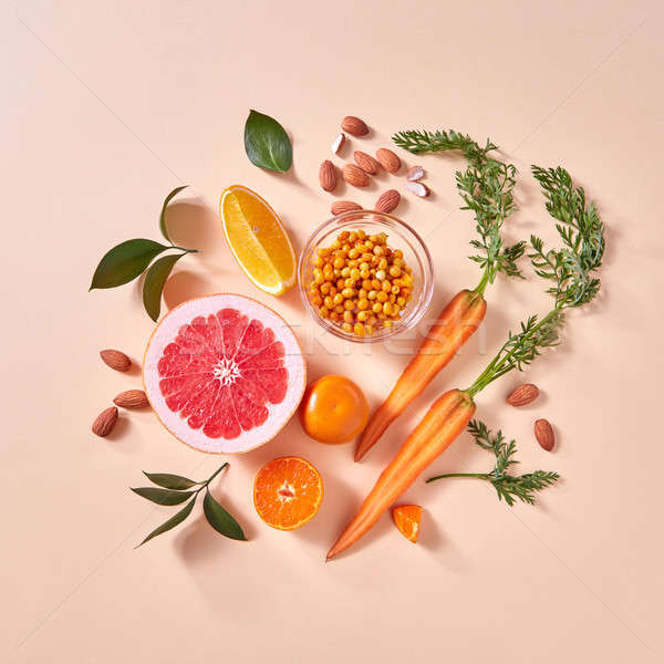 Natural organic citrus fruits, carrots, sea buckthorn berries - ingredients for making homemade deto Stock photo © artjazz