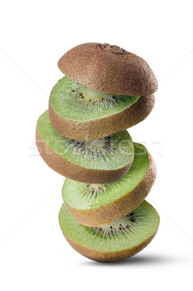 Stock photo: Falling slices of kiwi fruit isolated on white background
