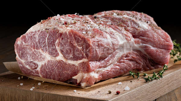 Photo of raw meat. Pork neck with herbs Stock photo © artjazz