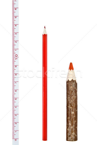 Stock photo: Red thick and thin pencils with ruler isloated on white