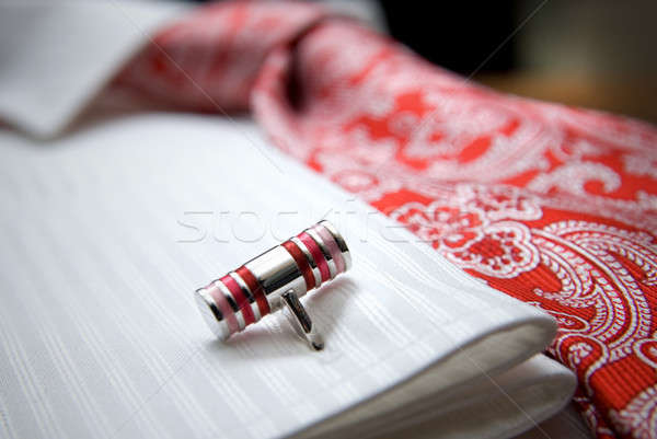close-up photo of stud on white shirt with red tie Stock photo © artjazz