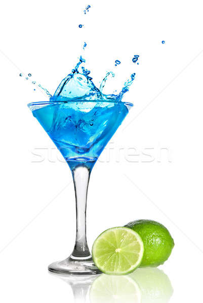 Blue curacao cocktail with splash and green lime isolated on white Stock photo © artjazz