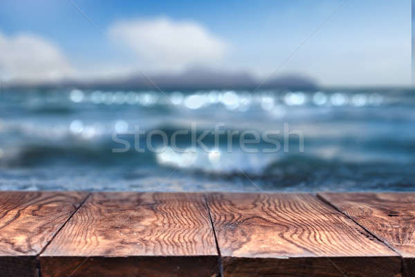 Empty wooden table with sea on background Stock photo © artjazz