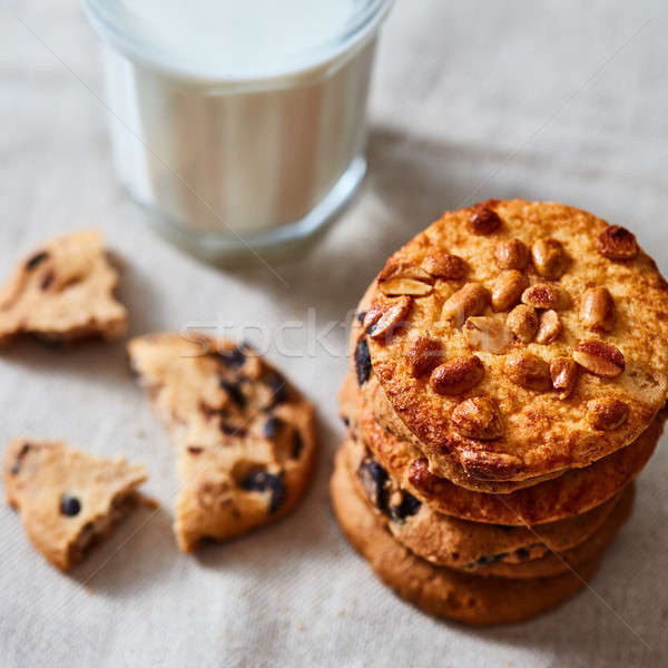 The stack of cookies of chocolate chunks and peanut for Santa Claus on a textile towel. Stock photo © artjazz