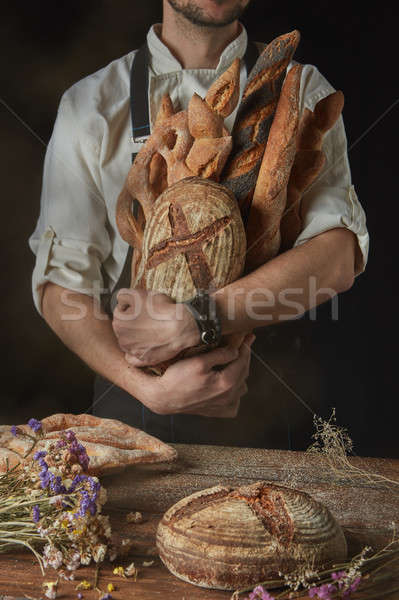 Baker keeps a variety of bread Stock photo © artjazz