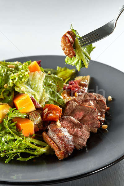 salad with pumpkin on white background Stock photo © artjazz