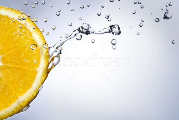 fresh water drops on orange Stock photo © artjazz