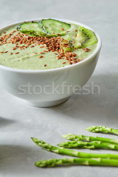 Healthy naturally green freshly squeezed smoothy of vegetables on a stone background Stock photo © artjazz