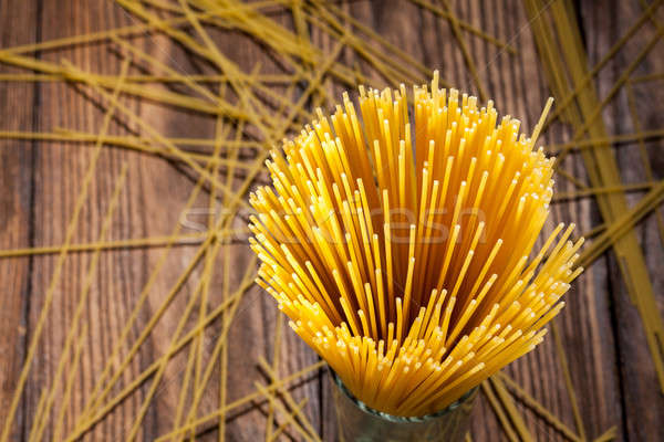 italian spaghetti on wooden background Stock photo © artjazz