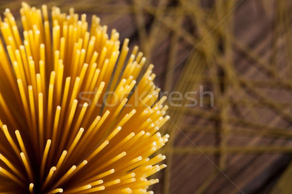 italian spaghetti on wooden background Stock photo © artjazz