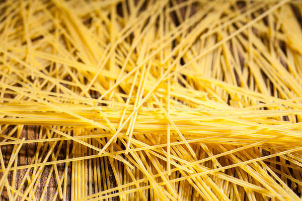 italian spaghetti on wooden background Stock photo © artjazz