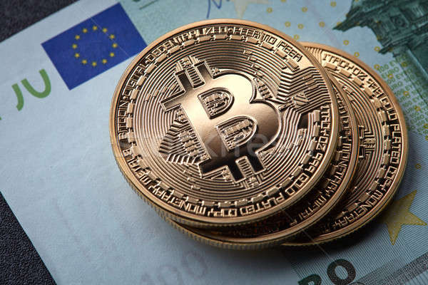 Három arany érmék bitcoin boglya papír Euro Stock fotó © artjazz