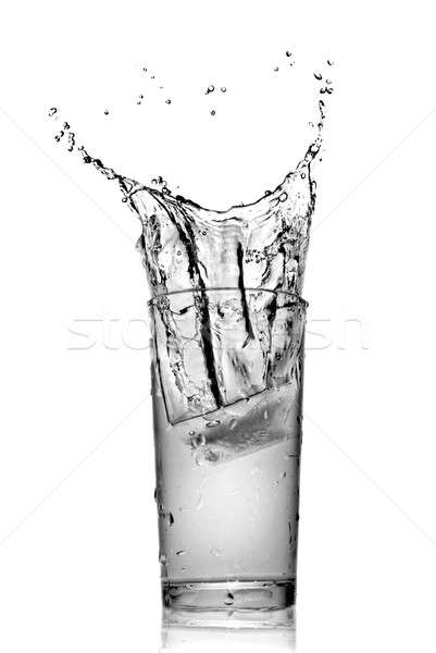 Stock photo: water splash in glass isolated on white