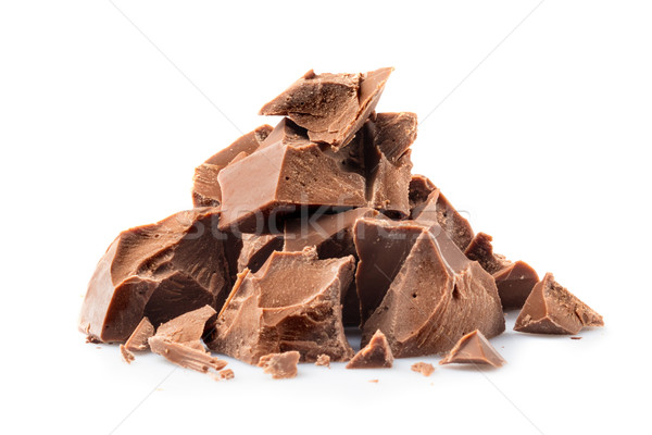 Stock photo: Pieces of milk chocolate isolated on white