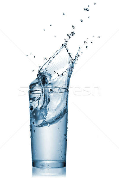 Stock photo: water splash in glass isolated on white