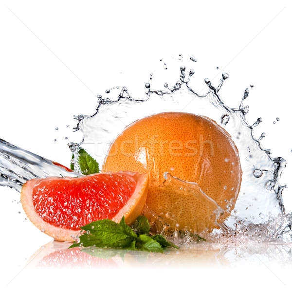 Water splash on grapefruit with mint isolated on white Stock photo © artjazz