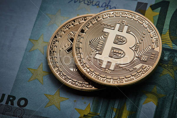 Gold coin Bitcoins, and Euro banknote Cryptocurrency Stock photo © artjazz