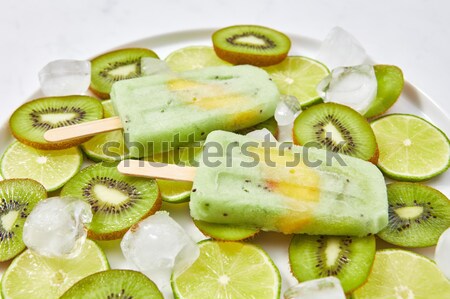 Homemade ice cream on a stick with a piece of peach. Pattern fro Stock photo © artjazz