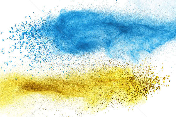 Blue and yellow powder explosion isolated Stock photo © artjazz