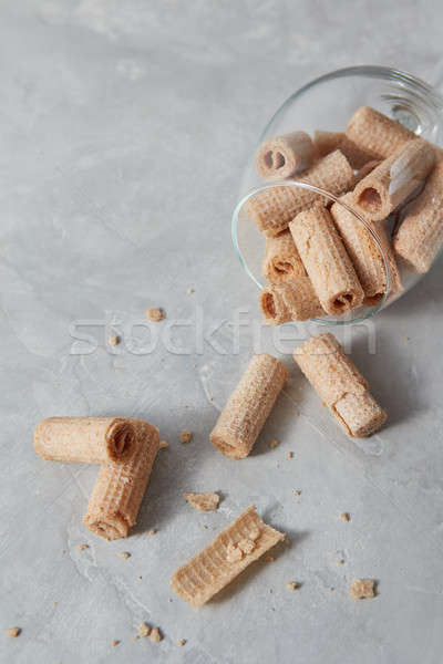 Waffle crispy sticks in a glass cup dessert for wine on a gray s Stock photo © artjazz