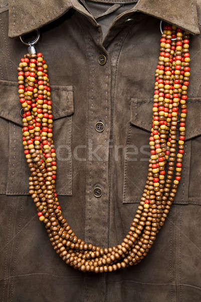brown shirt with color necklace Stock photo © artjazz
