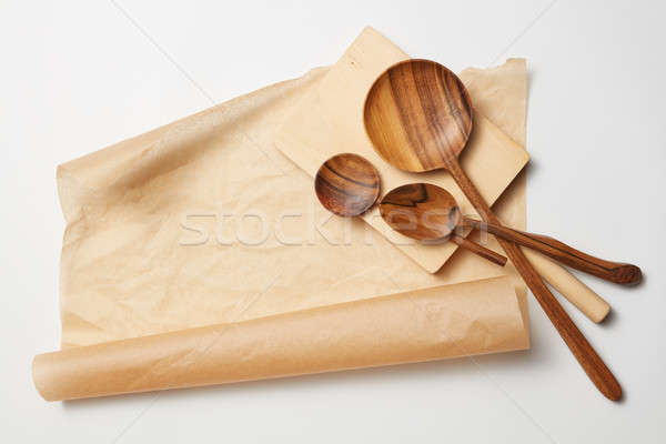 wooden spoons on baking paper Stock photo © artjazz
