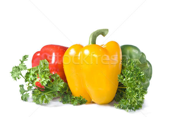 red, yellow and green pepper with parsley isolated on white Stock photo © artjazz