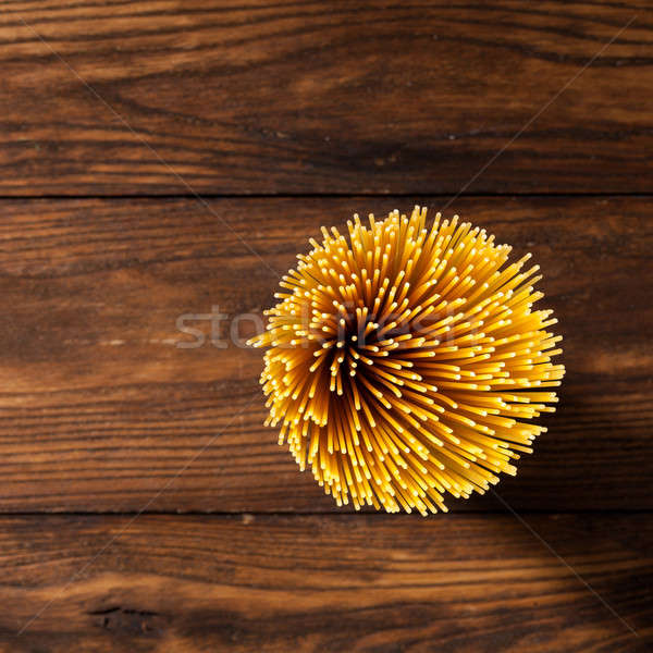 italian spaghetti on wooden background Stock photo © artjazz