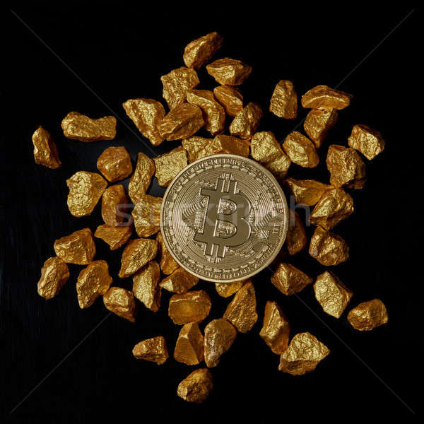 Arany bitcoin érme fekete fektet egymásra pakolva Stock fotó © artjazz