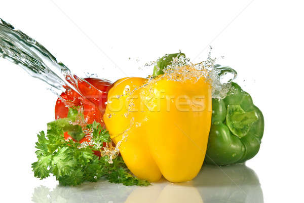 red, yellow, green pepper and parsley with water splash isolated on white Stock photo © artjazz