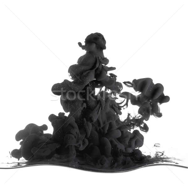 Splash of black ink in dropped into the water on white Stock photo © artjazz