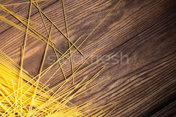 italian spaghetti on wooden background Stock photo © artjazz