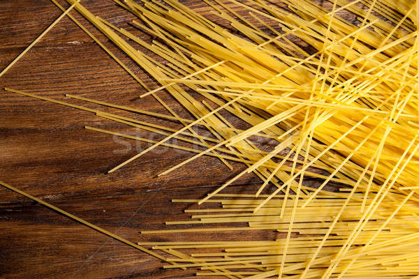 italian spaghetti on wooden background Stock photo © artjazz