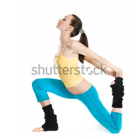Piękna dziewczyna gimnastyka biały kobieta ciało wykonywania Zdjęcia stock © artjazz