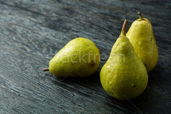 Three green pear on a black background Stock photo © artjazz