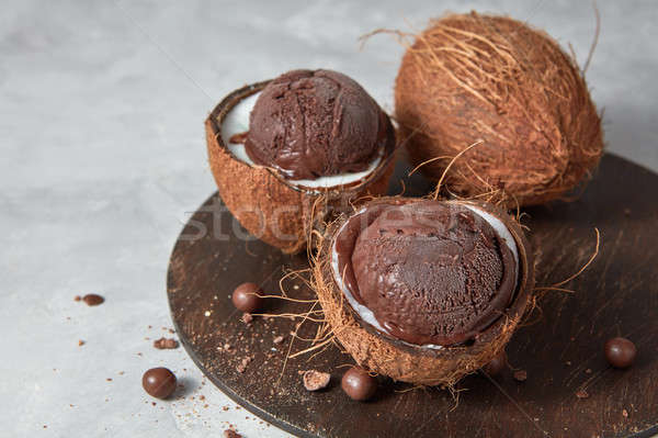 Delicious homemade chocolate ice cream in a coconut shell on a b Stock photo © artjazz