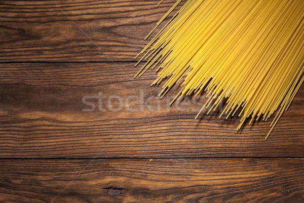 italian spaghetti on wooden background Stock photo © artjazz