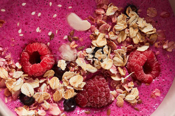 Close-up of smoothies with berries, oatmeal and flax seeds. Healthy breakfast Stock photo © artjazz