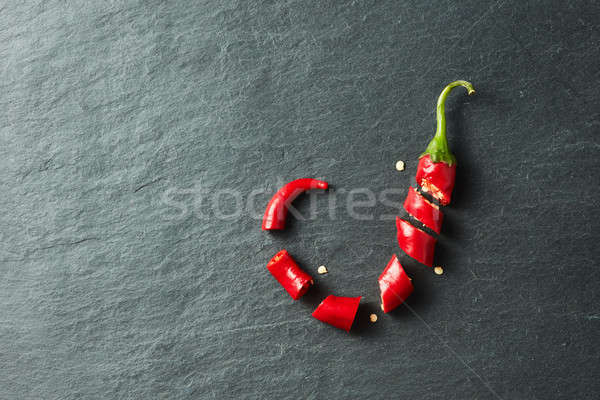 Aprított piros chilli bors fekete beton Stock fotó © artjazz