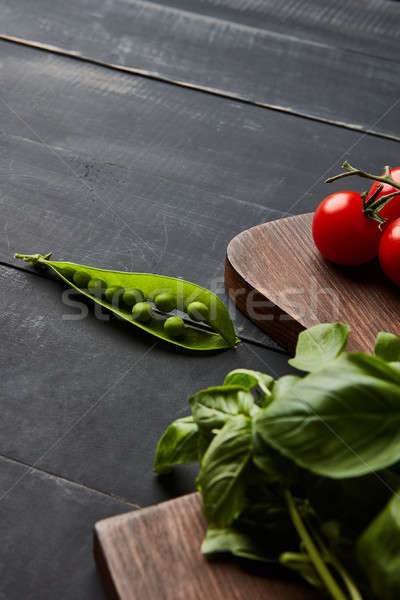 Fresh vegetables and spices of red and green colors on a wooden background Stock photo © artjazz