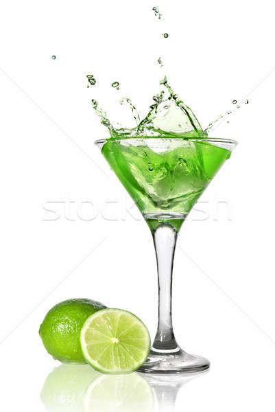 Green alchohol cocktail with splash and green lime isolated on white Stock photo © artjazz