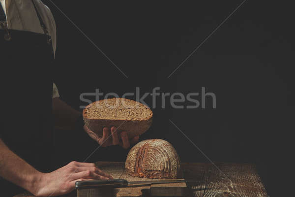 Hands holding half bread Stock photo © artjazz