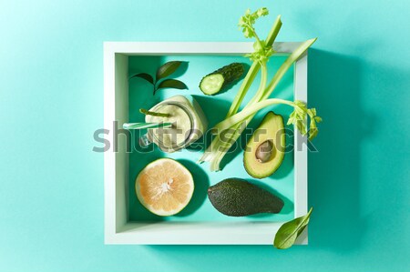 Natural ingredients for healthy smoothie from avocado with cucumber, celery, shpinach, lemon in jar  Stock photo © artjazz