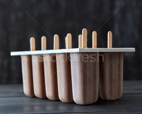 Caffè gelato stick plastica buio legno Foto d'archivio © artjazz