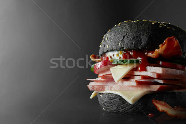 Black Burger with Cheese. Stock photo © artjazz