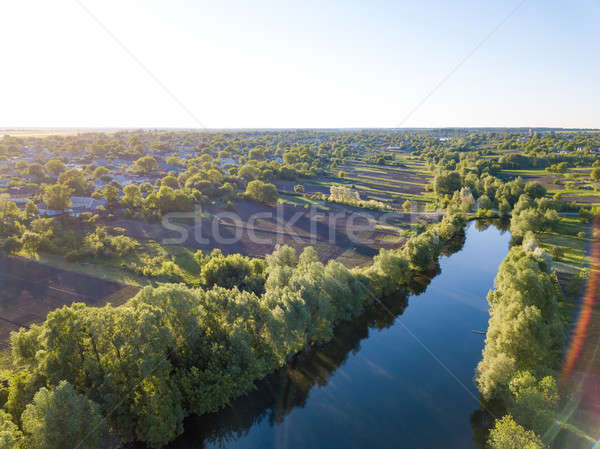aerial view of a blue lake, green forest and blue sky Stock photo © artjazz