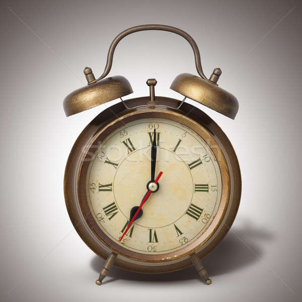 Brown old style alarm clock with shadow Stock photo © artjazz