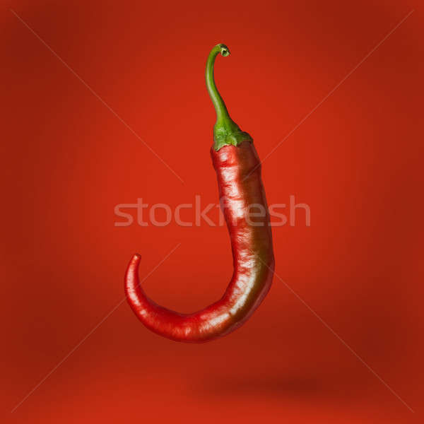 Hot chilli pepper floating over Stock photo © artjazz